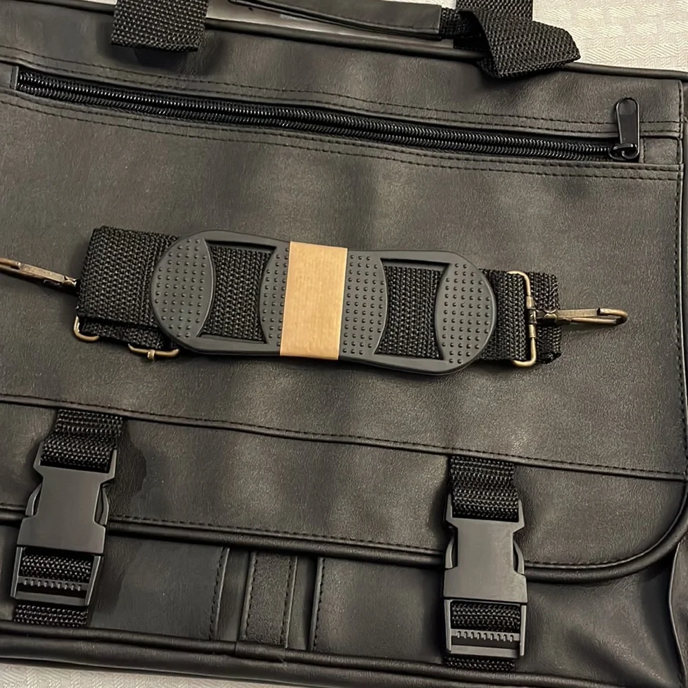 Briefcase, Black, Handles and Shoulder Straps lots of storage.